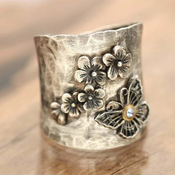 Bague large avec fleur et papillon