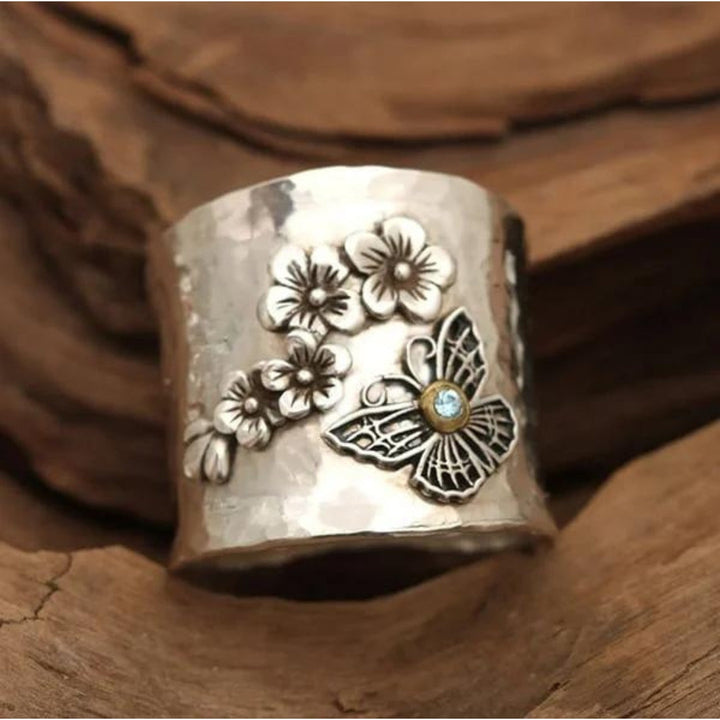 Bague large avec fleur et papillon