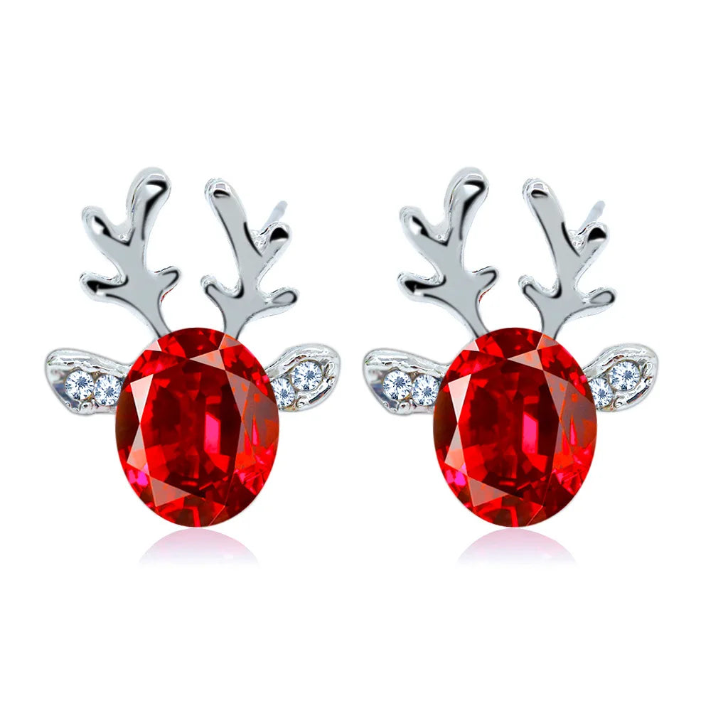 Boucles d'oreilles en métal avec un renne de Noël en cristal