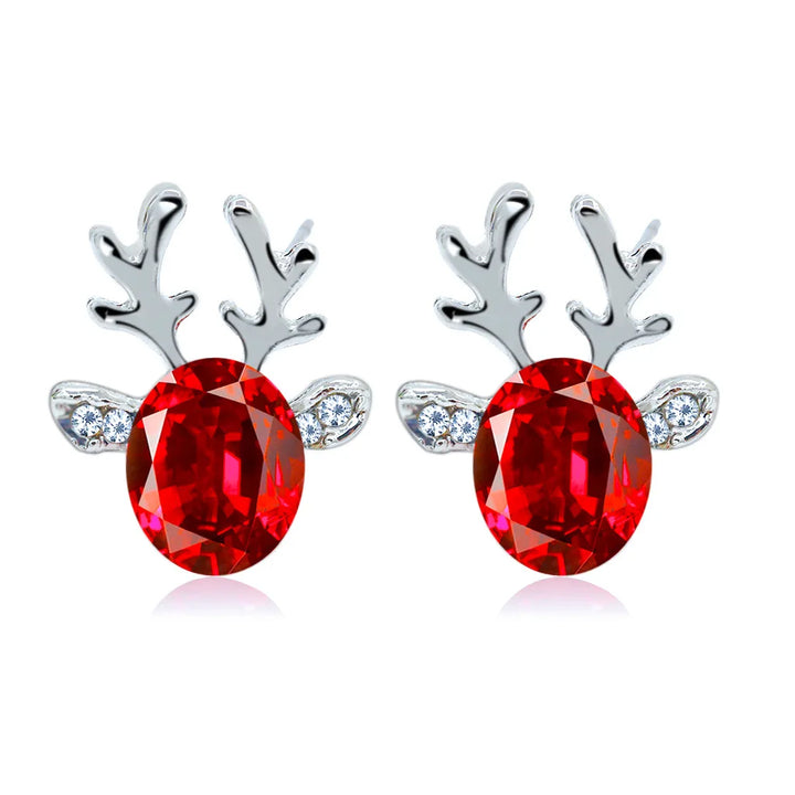 Boucles d'oreilles en métal avec un renne de Noël en cristal