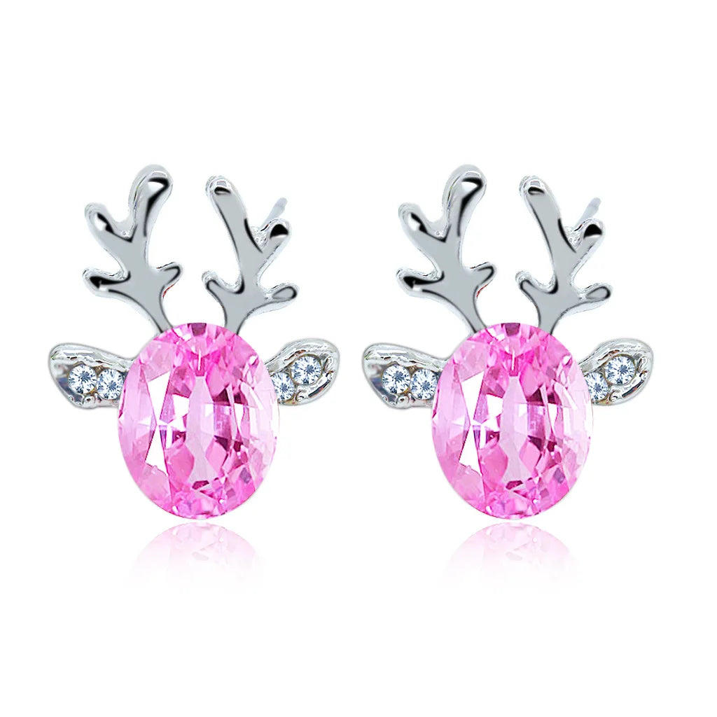 Boucles d'oreilles en métal avec un renne de Noël en cristal