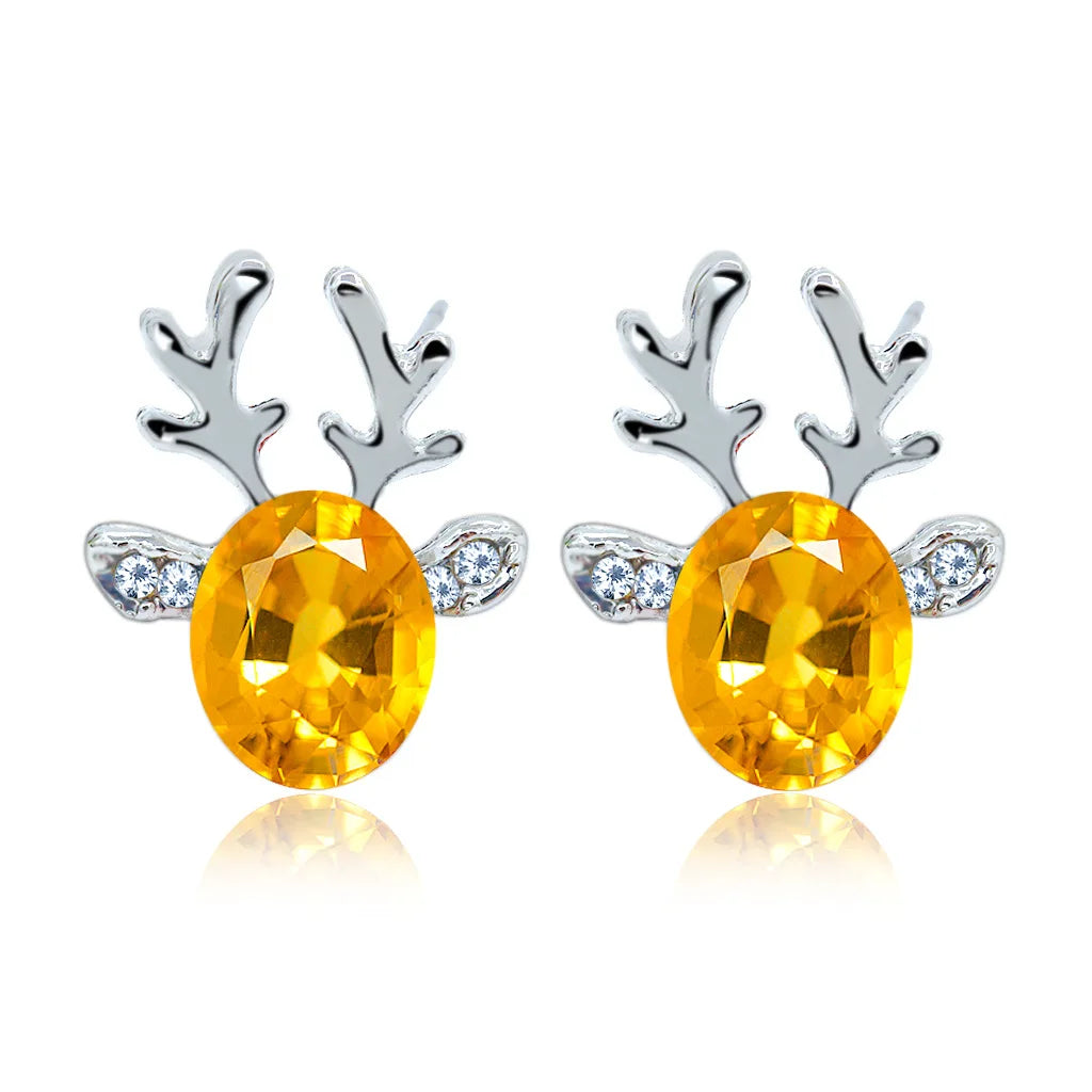 Boucles d'oreilles en métal avec un renne de Noël en cristal