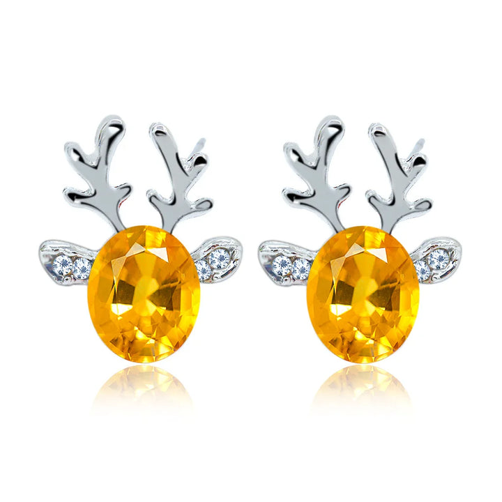 Boucles d'oreilles en métal avec un renne de Noël en cristal