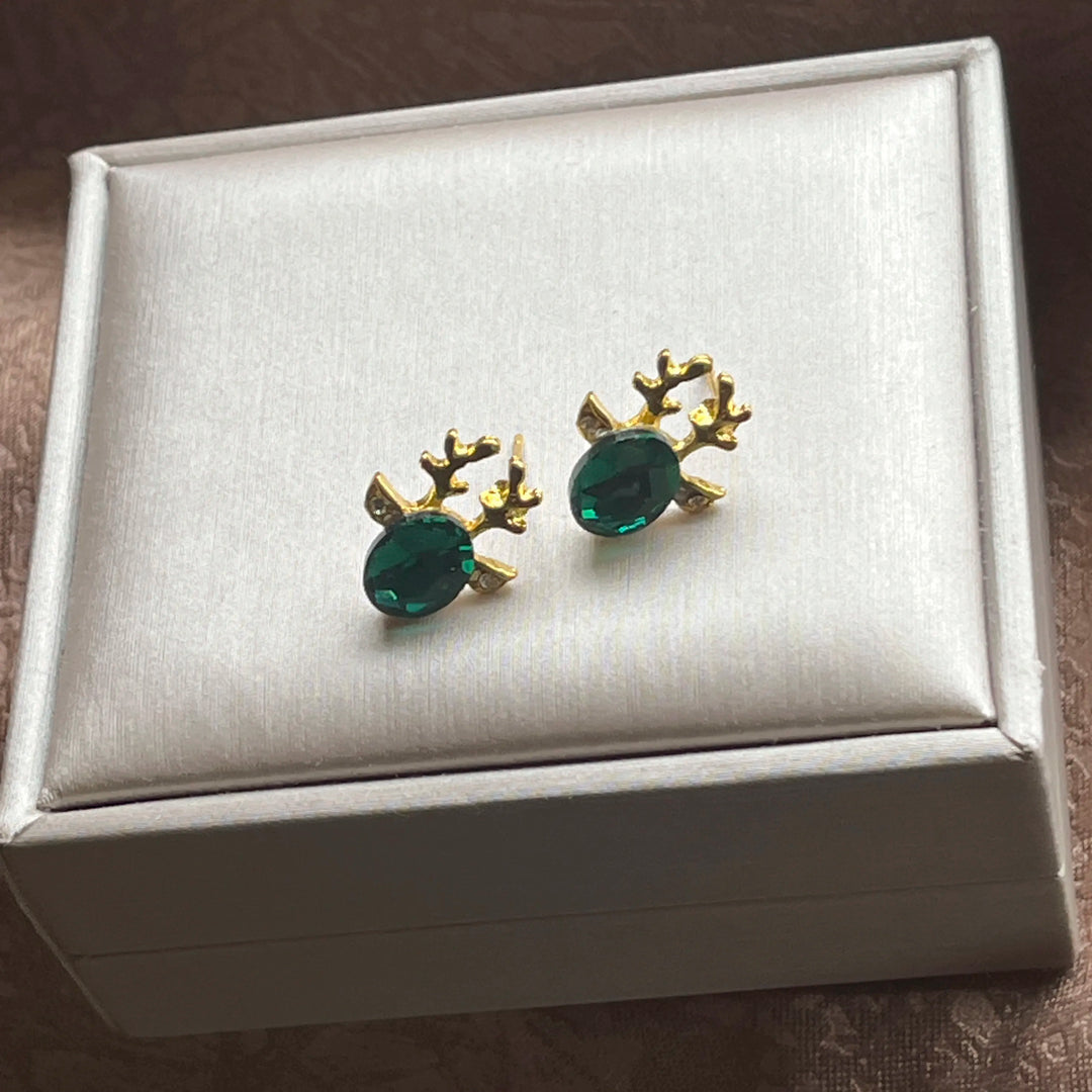 Boucles d'oreilles en métal avec un renne de Noël en cristal