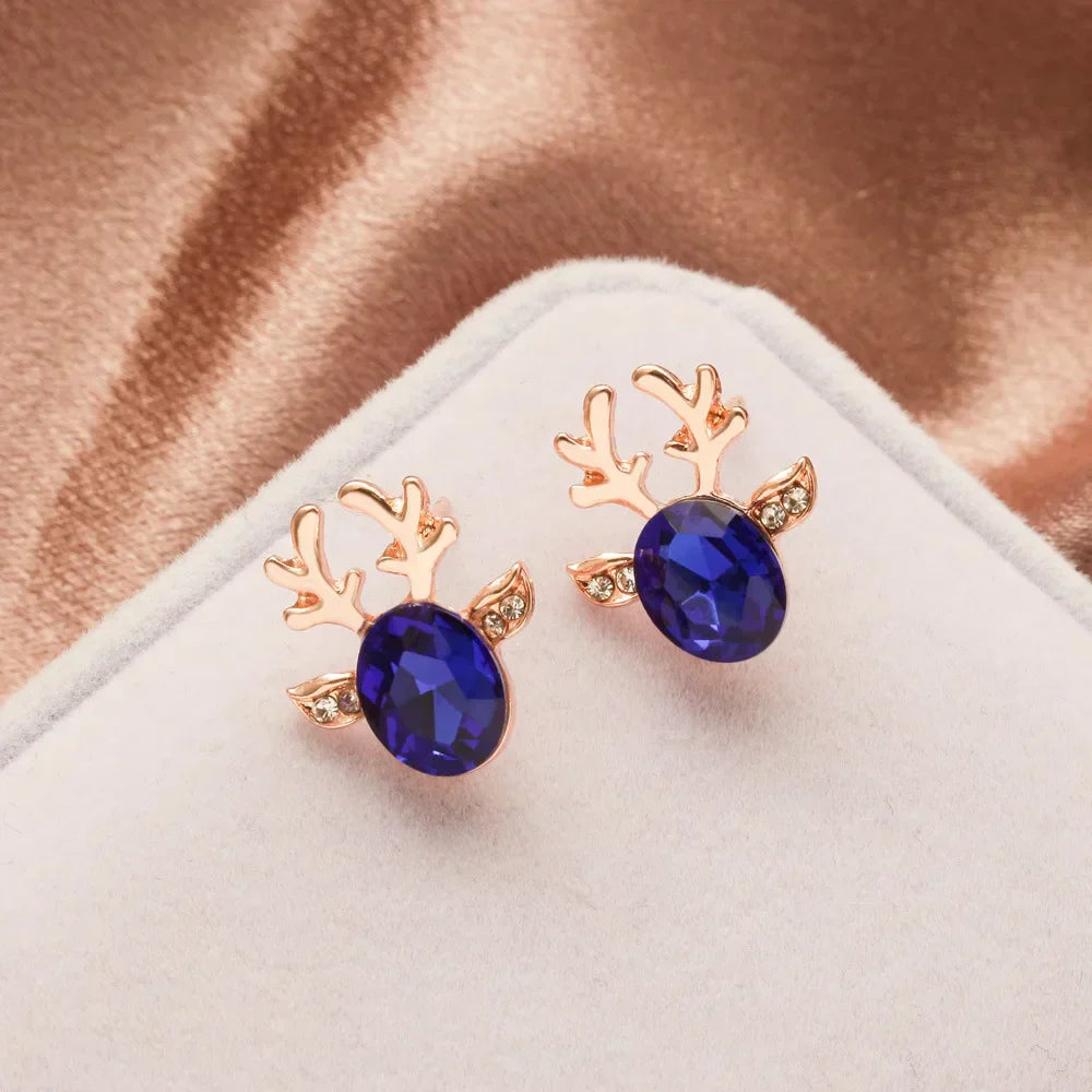Boucles d'oreilles en métal avec un renne de Noël en cristal
