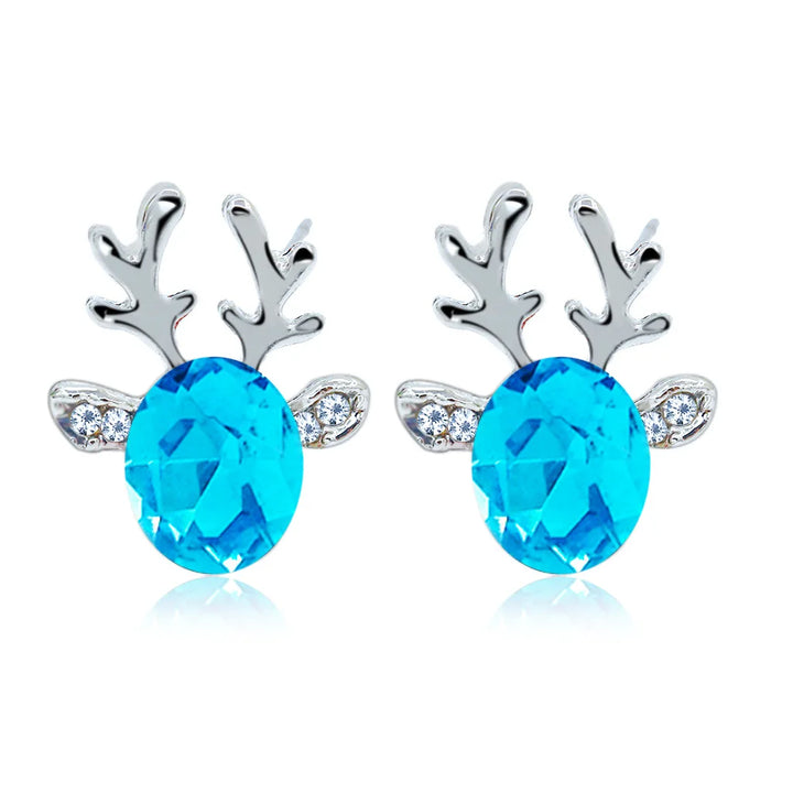 Boucles d'oreilles en métal avec un renne de Noël en cristal