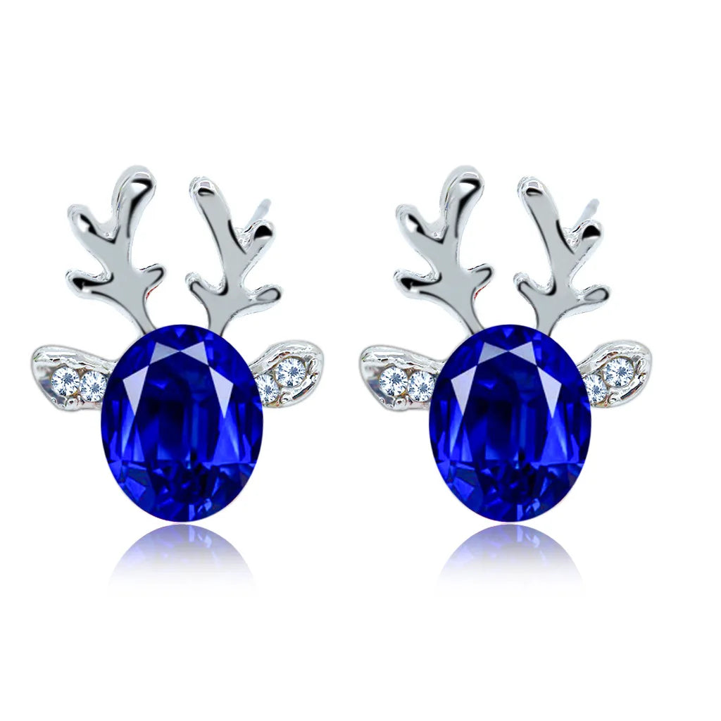 Boucles d'oreilles en métal avec un renne de Noël en cristal