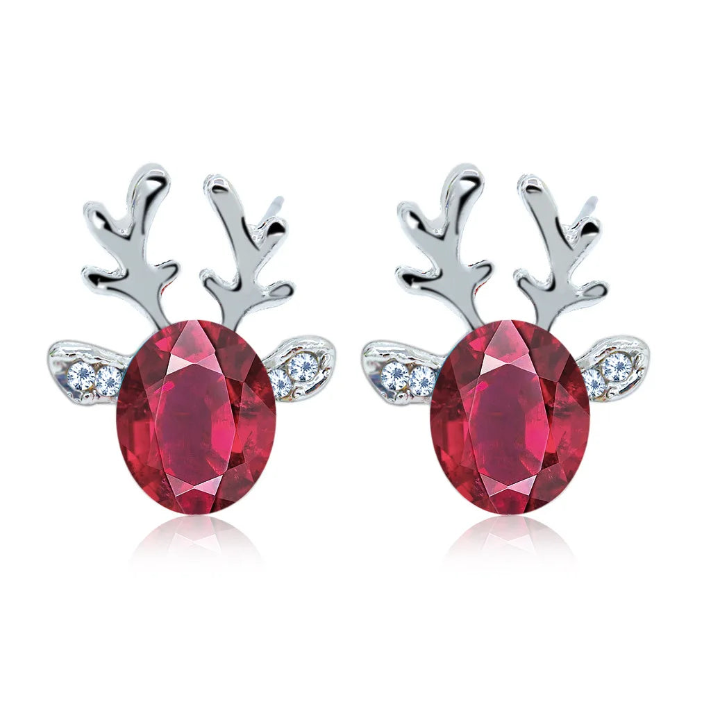 Boucles d'oreilles en métal avec un renne de Noël en cristal