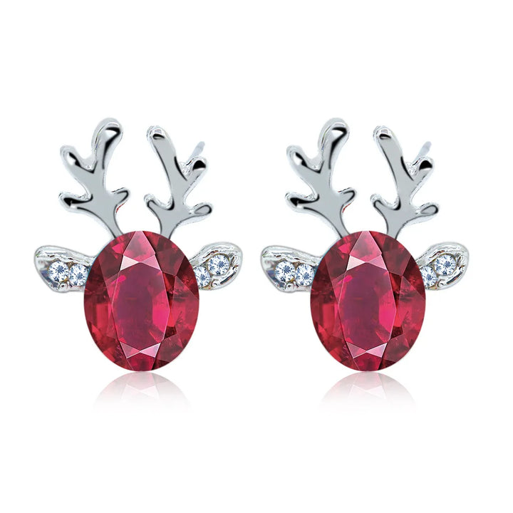 Boucles d'oreilles en métal avec un renne de Noël en cristal