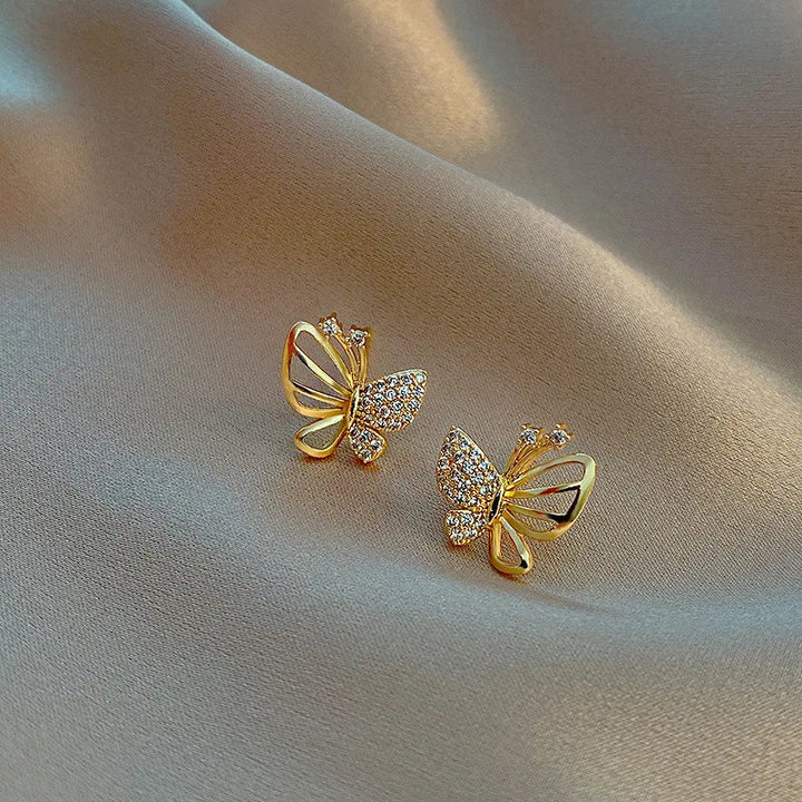 Boucles d'oreilles élégantes en forme de papillon avec des zircons