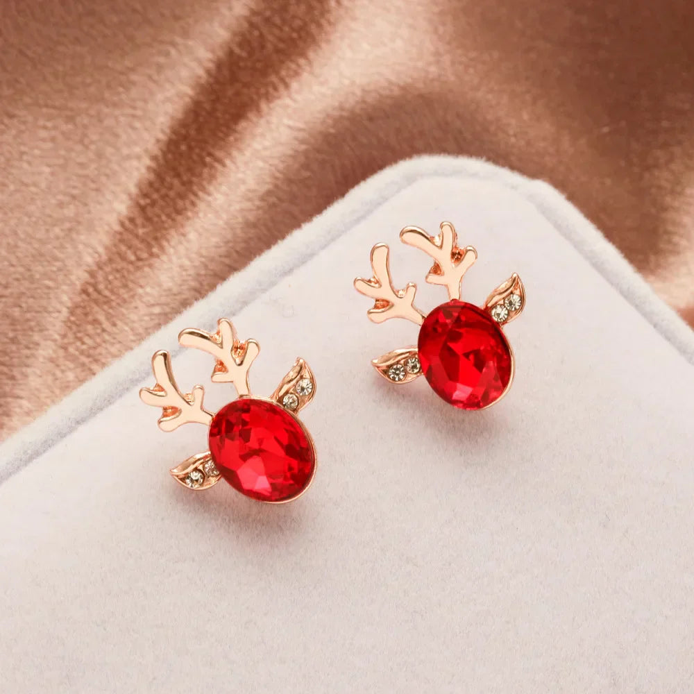 Boucles d'oreilles en métal avec un renne de Noël en cristal