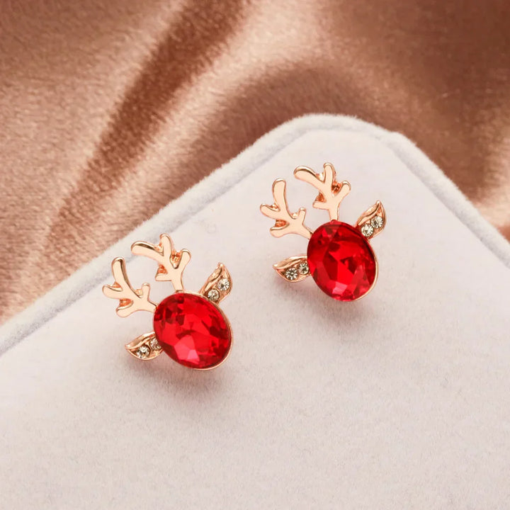 Boucles d'oreilles en métal avec un renne de Noël en cristal