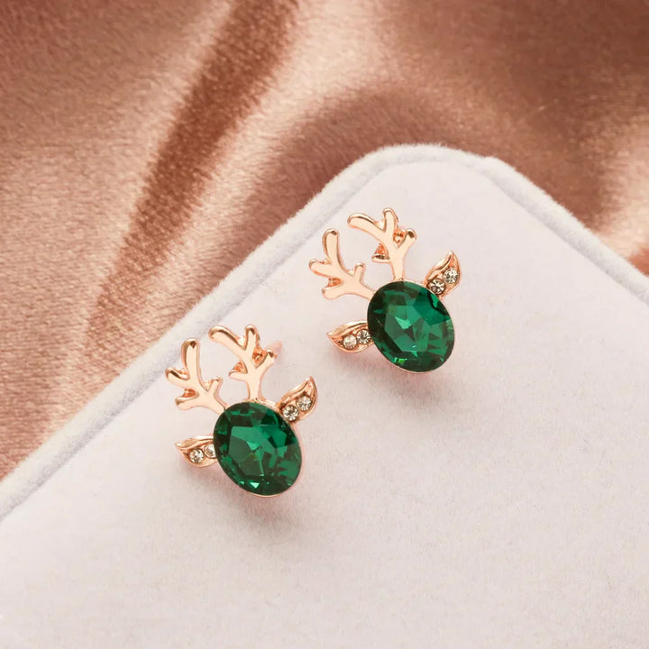 Boucles d'oreilles en métal avec un renne de Noël en cristal