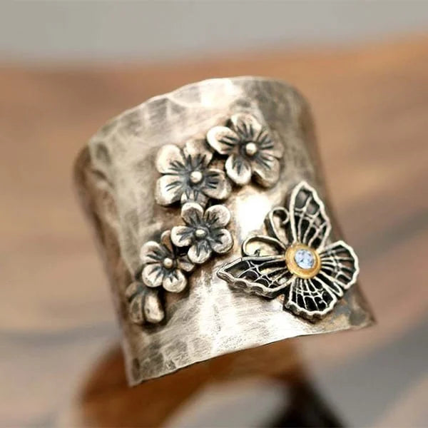 Bague large avec fleur et papillon