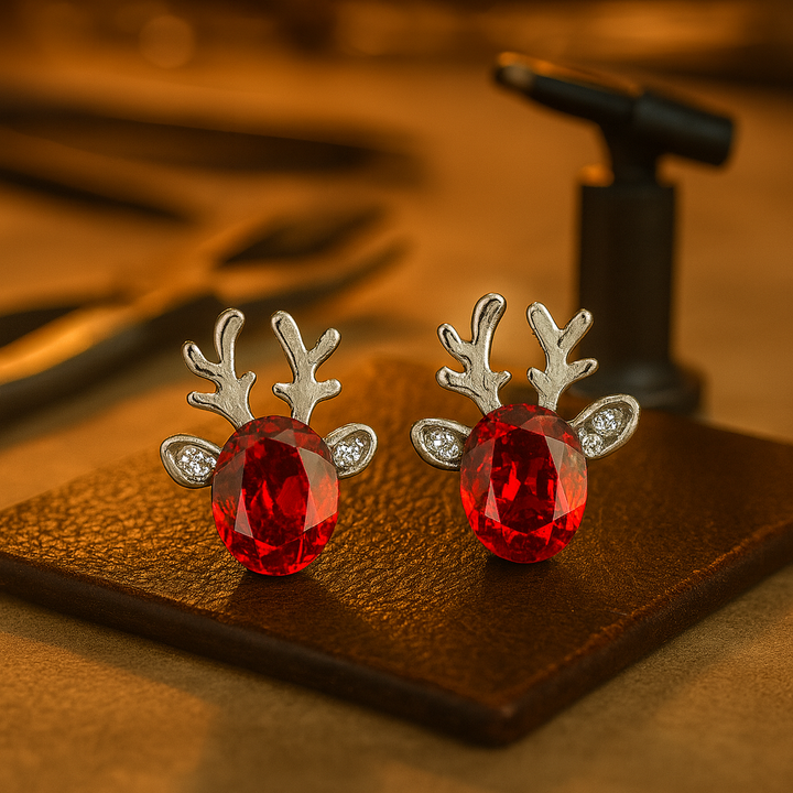Boucles d'oreilles en métal avec un renne de Noël en cristal