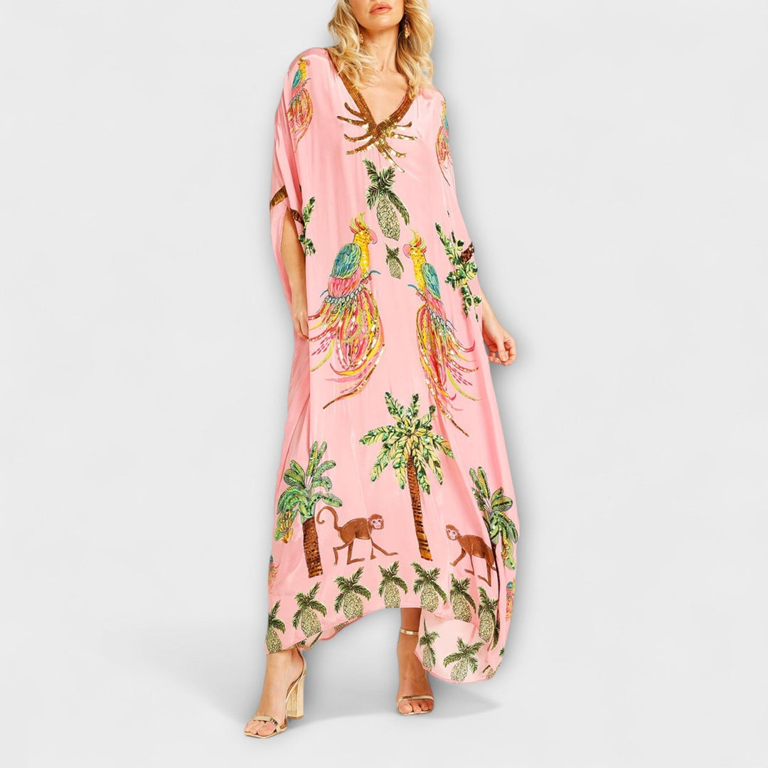 Linda - Robe impressionnante avec des bretelles asymétriques et un imprimé de palmiers