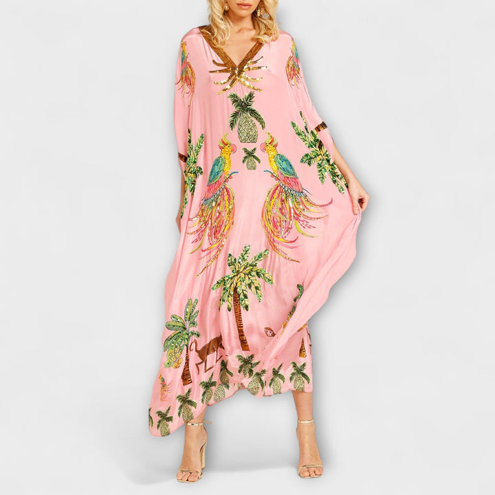 Linda - Robe impressionnante avec des bretelles asymétriques et un imprimé de palmiers