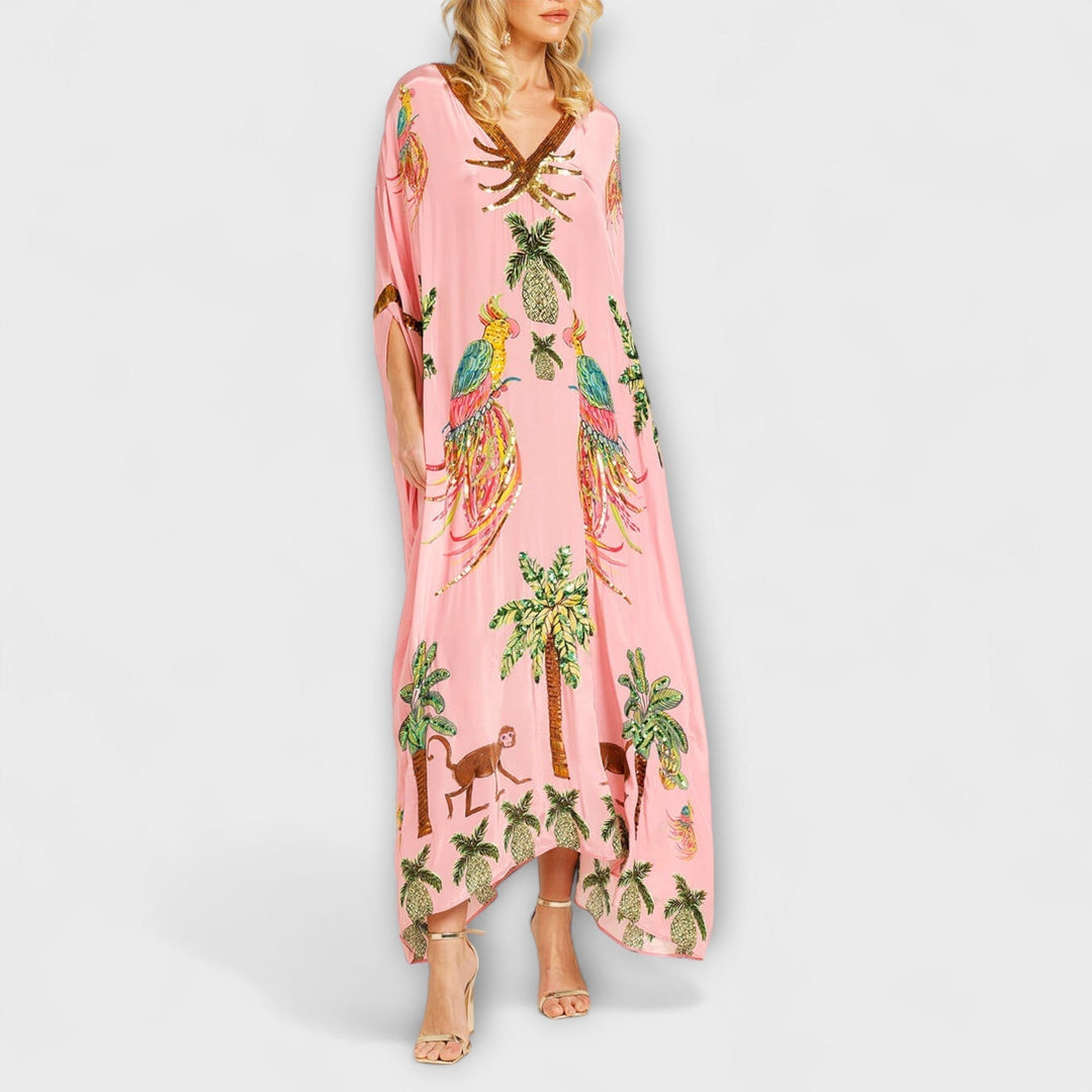 Linda - Robe impressionnante avec des bretelles asymétriques et un imprimé de palmiers
