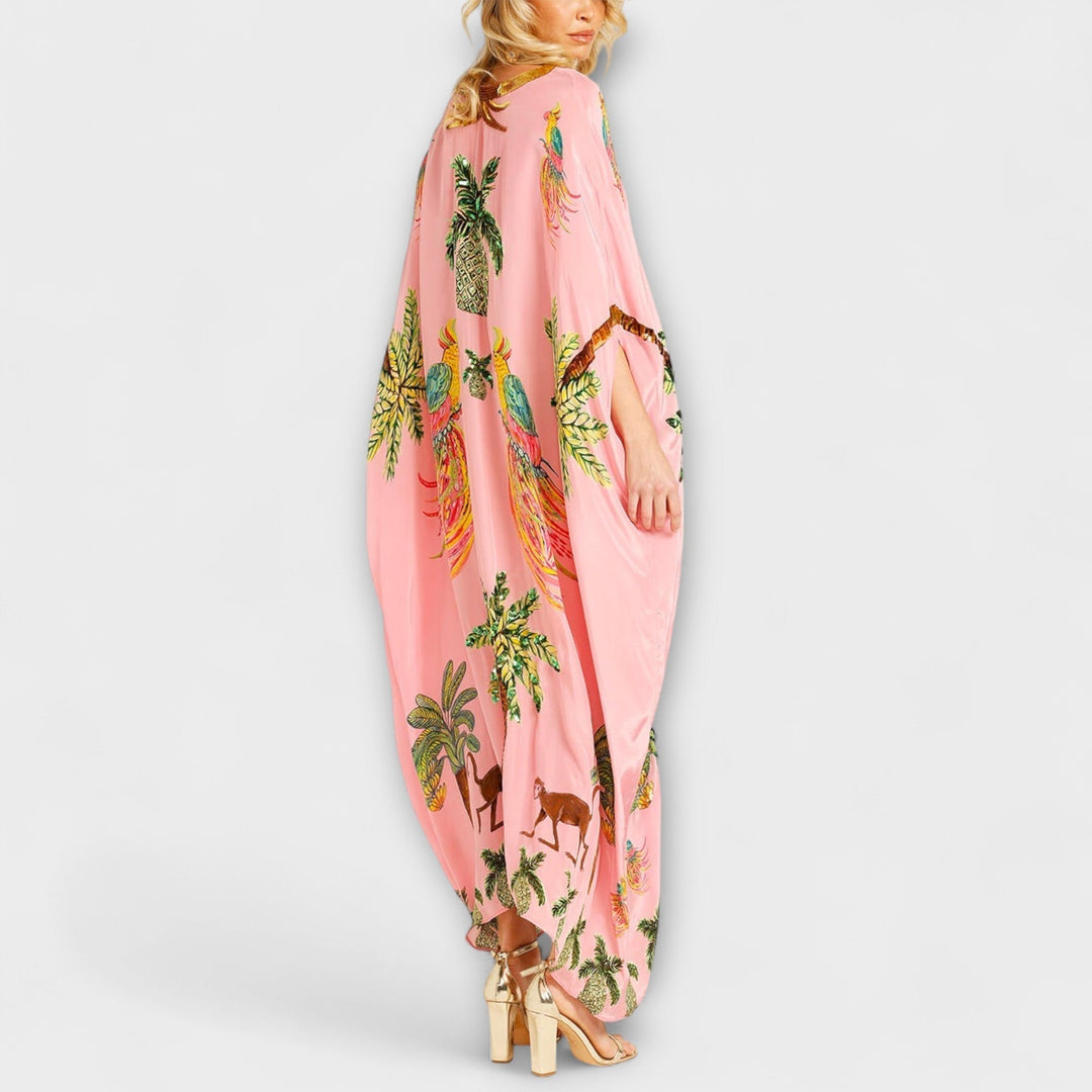 Linda - Robe impressionnante avec des bretelles asymétriques et un imprimé de palmiers