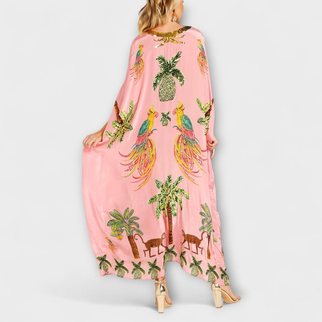Linda - Robe impressionnante avec des bretelles asymétriques et un imprimé de palmiers