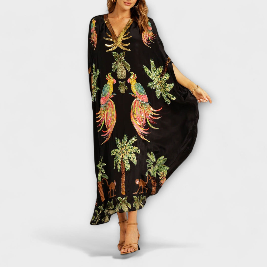 Linda - Robe impressionnante avec des bretelles asymétriques et un imprimé de palmiers