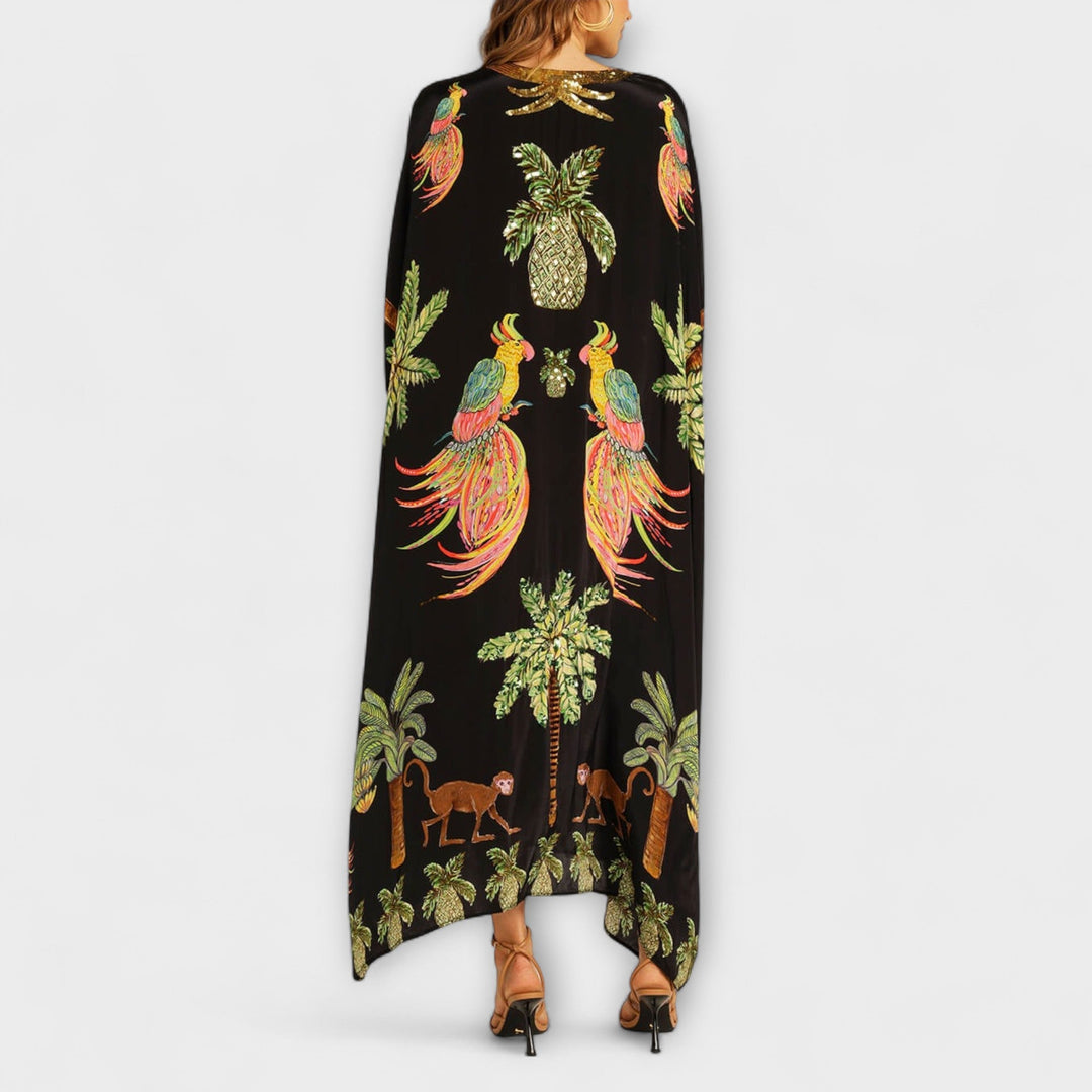 Linda - Robe impressionnante avec des bretelles asymétriques et un imprimé de palmiers