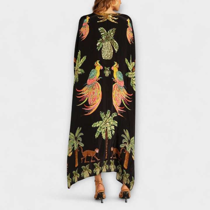 Linda - Robe impressionnante avec des bretelles asymétriques et un imprimé de palmiers