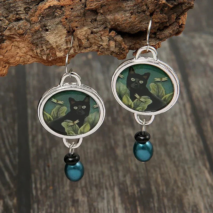 Boucles d'oreilles pendantes vintage avec chat noir tropical