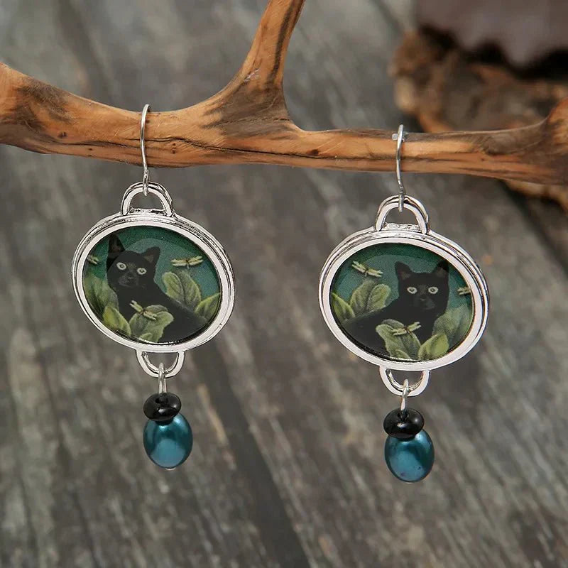 Boucles d'oreilles pendantes vintage avec chat noir tropical