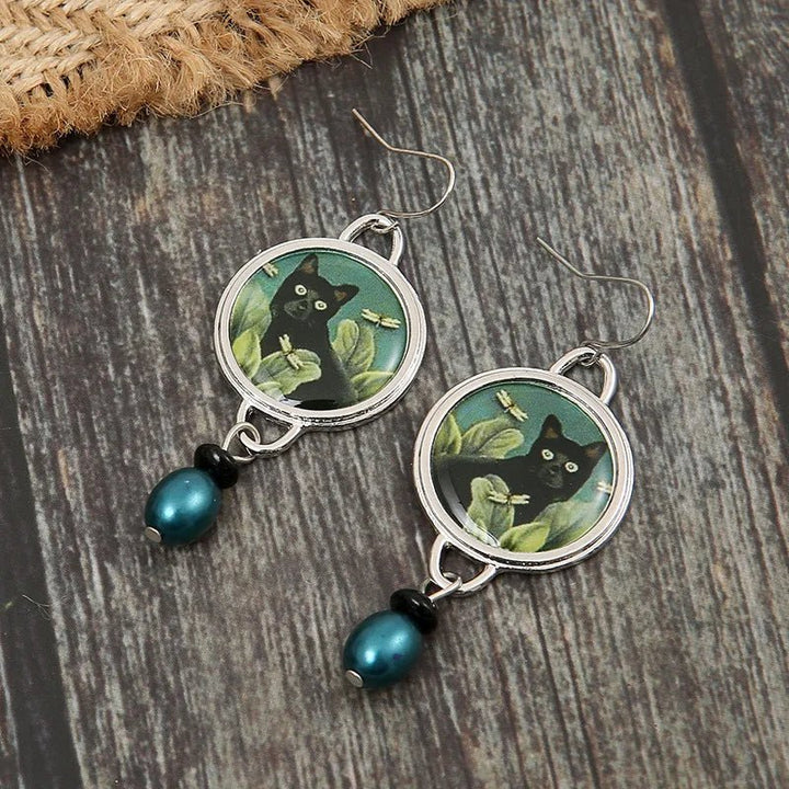 Boucles d'oreilles pendantes vintage avec chat noir tropical